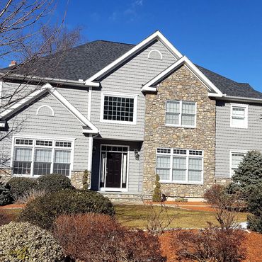 New siding and cultured stone veneer completed