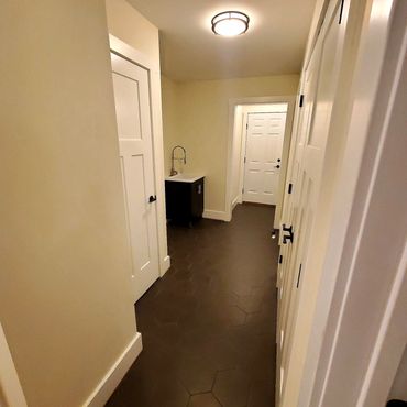 Hexagon tile installed in the mudroom and hallway