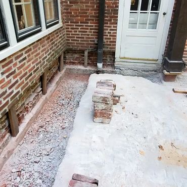 Inside corner brickwork is removed and shored