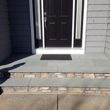 Bluestone step and landing with cultured stone risers