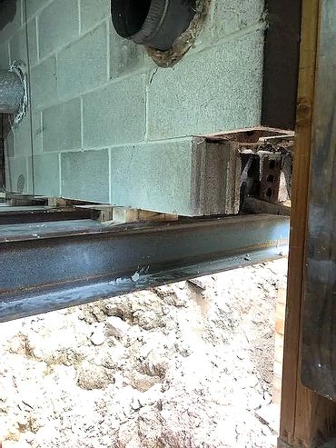 Steel I beams are used to shore the 40,000lb chimney structure