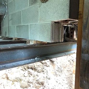 Steel I beams are used to shore the 40,000lb chimney structure