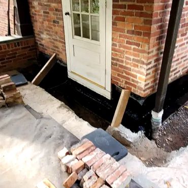 Interior brick leaf is waterproofed down to foundation