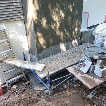 Blockwork is complete and two coats of sand and cement plaster is applied