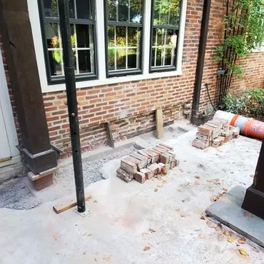 Wooden trellis is shored above 