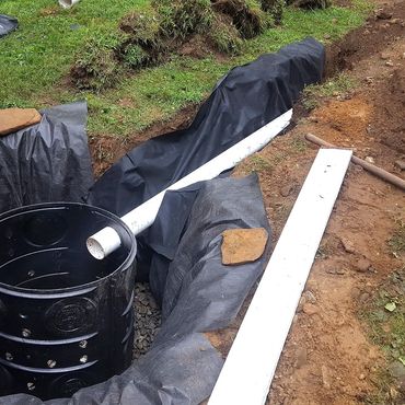 Dry well system container is installed on top of the stone