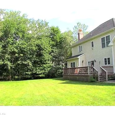 Stonecroft Lane back yard - Custom 14' x 18 composites deck looking out into Nathan Hale State Fores