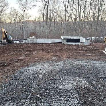 Concrete foundation backfilled