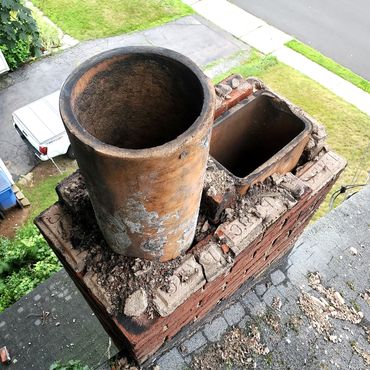 Chimney at the top is severely damaged including cracked flue liners. We took pictures a long the wa