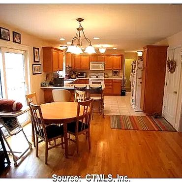 Dinette into the kitchen with custom cabinets