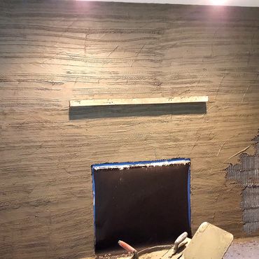 Fireplace plaster scratch coat with wire lath underneath