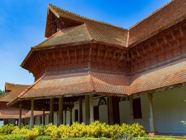 Traditional building with sloped tiled roof and wooden architecture.