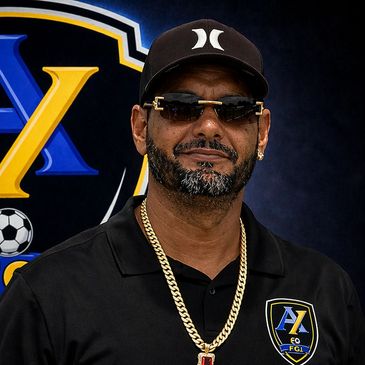 Man wearing sunglasses and a black cap.