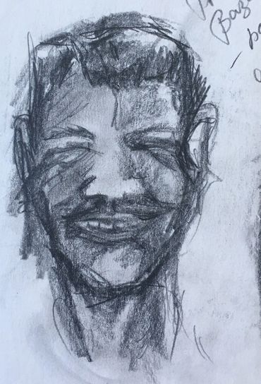 Charcoal sketch of a man's face with a mustache.