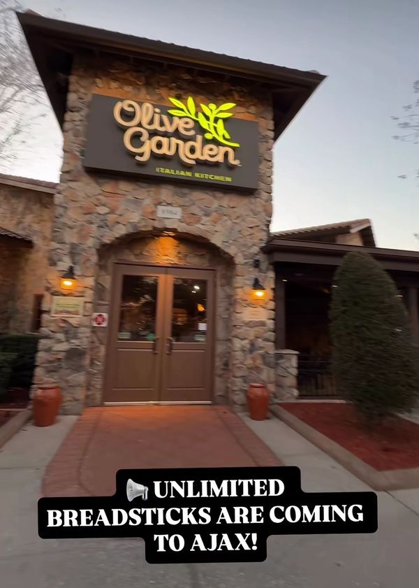 Olive Garden entrance with announcement of unlimited breadsticks coming to Ajax.