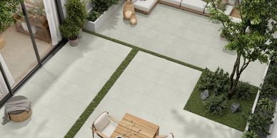 Concretia Chukum 24x48 porcelain tile in an outdoor courtyard