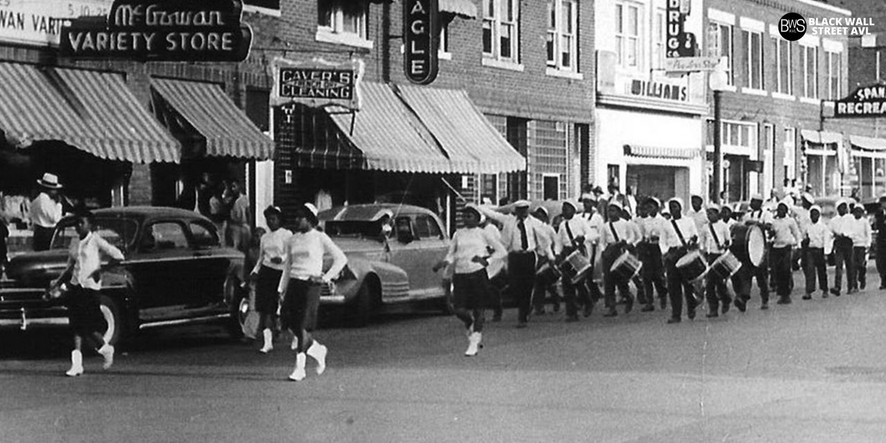 This photograph shows a parade held in the Oklahoma neighborhood during the 1930s or '40s. CREDITS: GREENWOOD CULTURAL CENTER