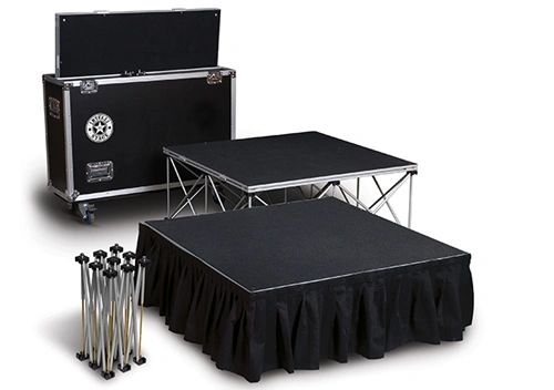Portable stage platform with collapsible legs and carrying case.