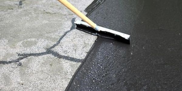 Asphalt Sealcoating applied by hand gives the even coverage of sealer to your pavement.