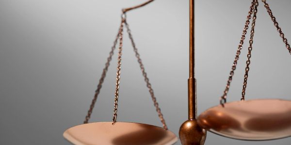 Close-up of a copper balance scale.