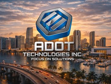 City skyline with a sunset backdrop and ADOT Technologies Inc logo.