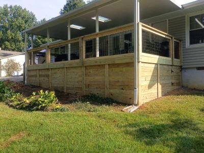 Newly built wooden deck attached to a house.