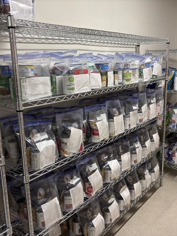 Organized pantry shelves with sealed food bags and labels.