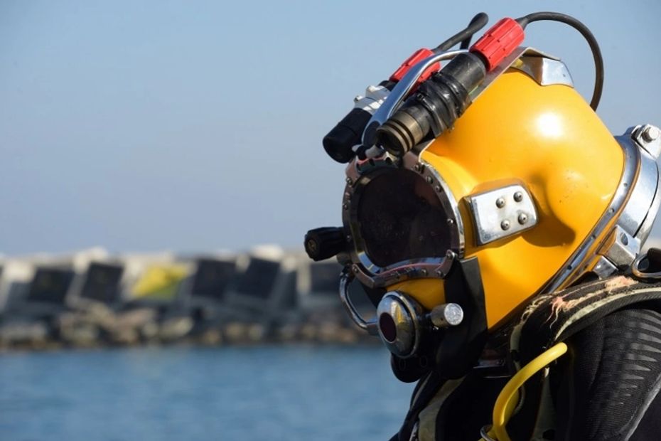 Kansas diver in yellow dive helmet 