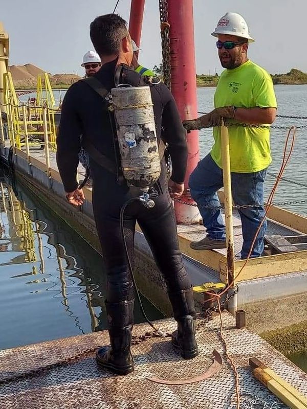 Performing a dive in kansas for dredge barge