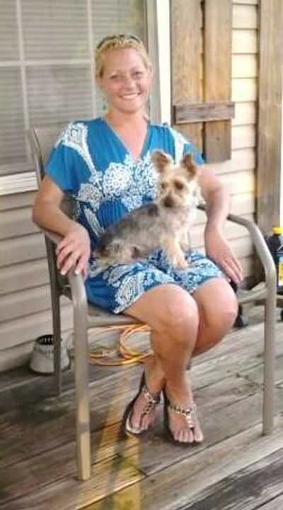 This is a photo of me and my first Yorkie, Rascal. He will always be my most favorite! 