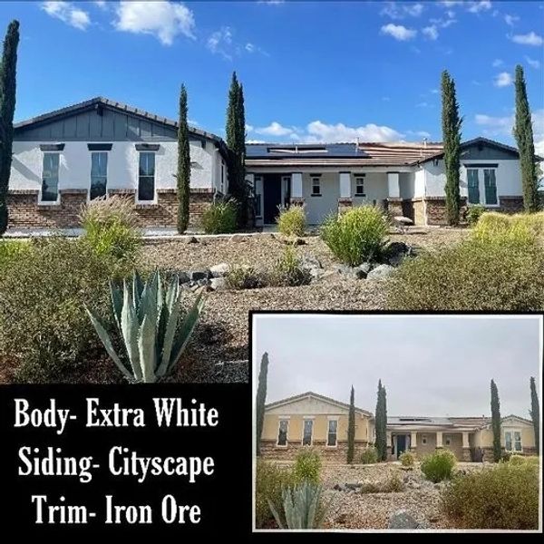 House exterior with white body, cityscape siding, and iron ore trim.