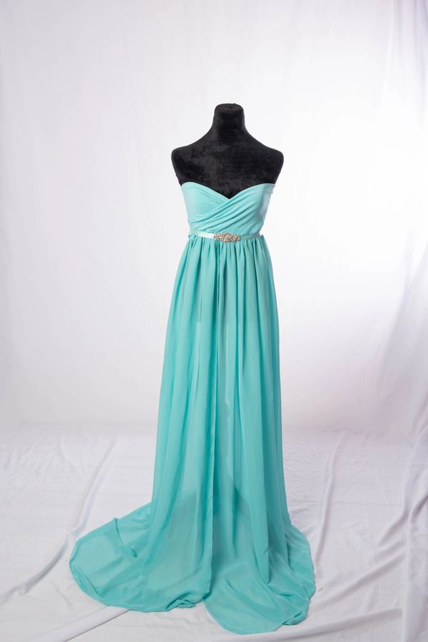 Elegant strapless turquoise evening gown with a jeweled waistband.