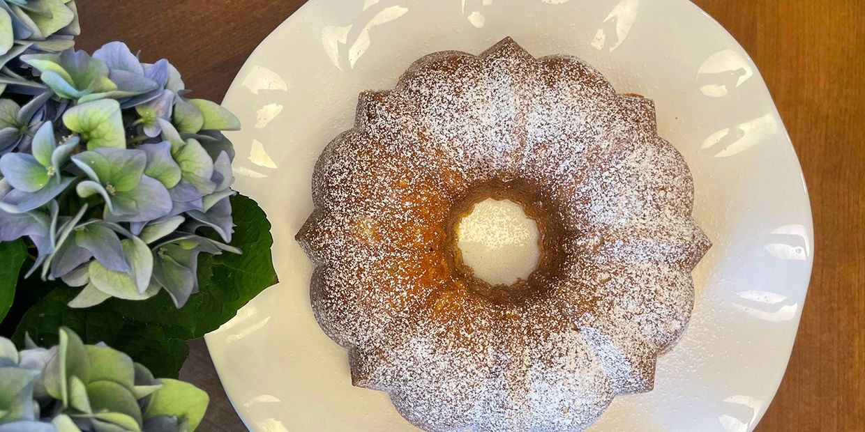 Buttermilk Pound Cake made in a bunt pan and served on a white plate