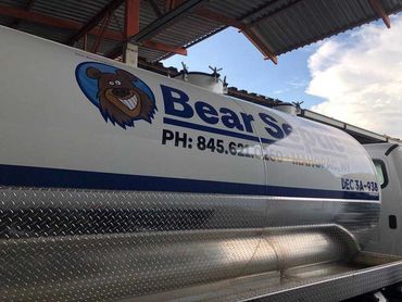 Bear-septic-pumping truck