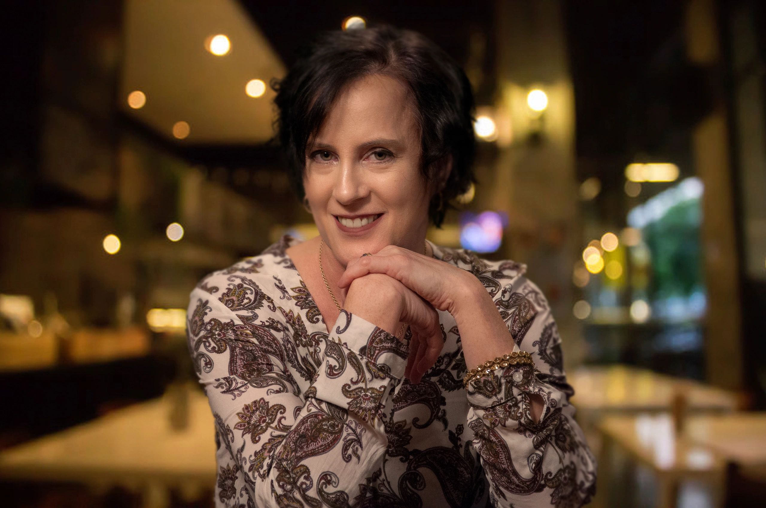 Barbara Wilson Arboleda in coffee shop; contact form
