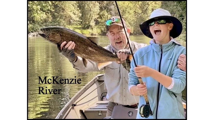 Saracen Stein with her first-ever salmon, caught on a McKenzie River fly fishing trip.