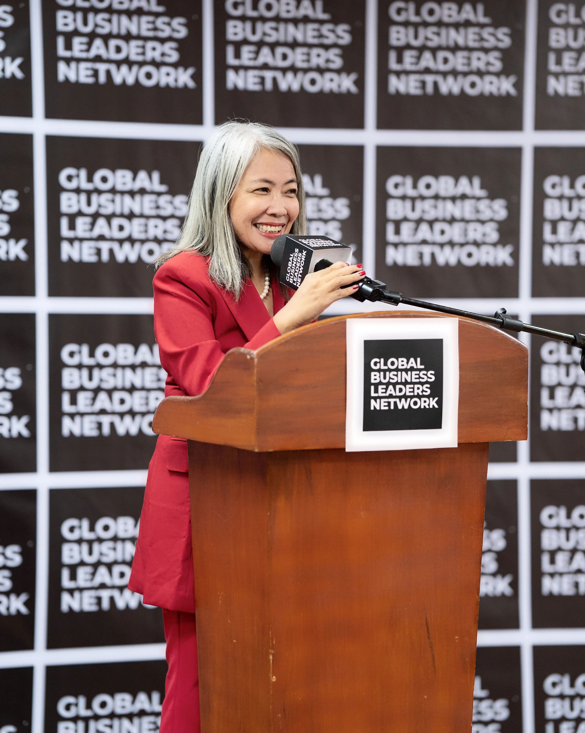 MaryJane Salomon, founder and chairperson of Global Business Leaders Network delivered her speech. 