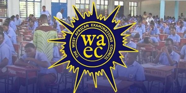 Students sitting for the West African Examinations Council exam in a large hall.