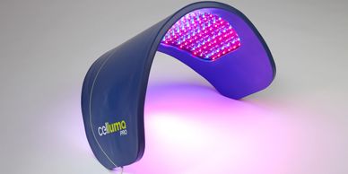 A sleek blue LED light therapy device emitting purple and red light.