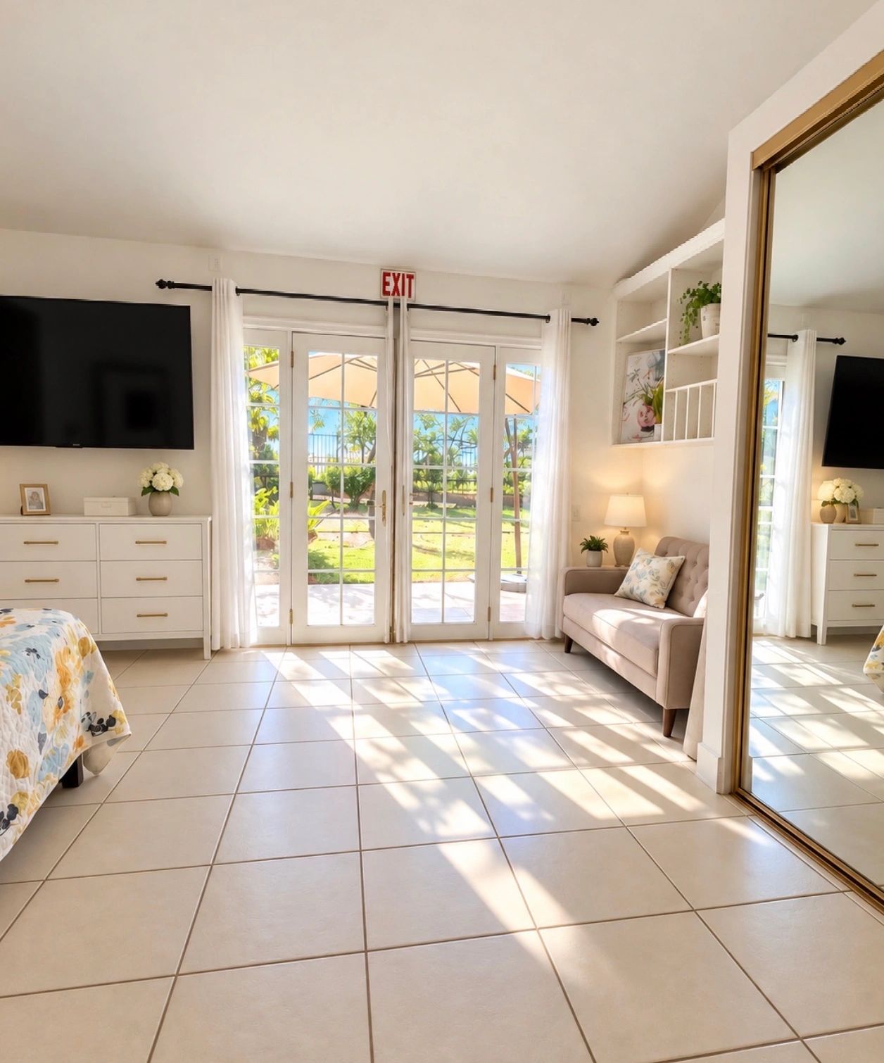 Sunlit room with glass doors leading outside.