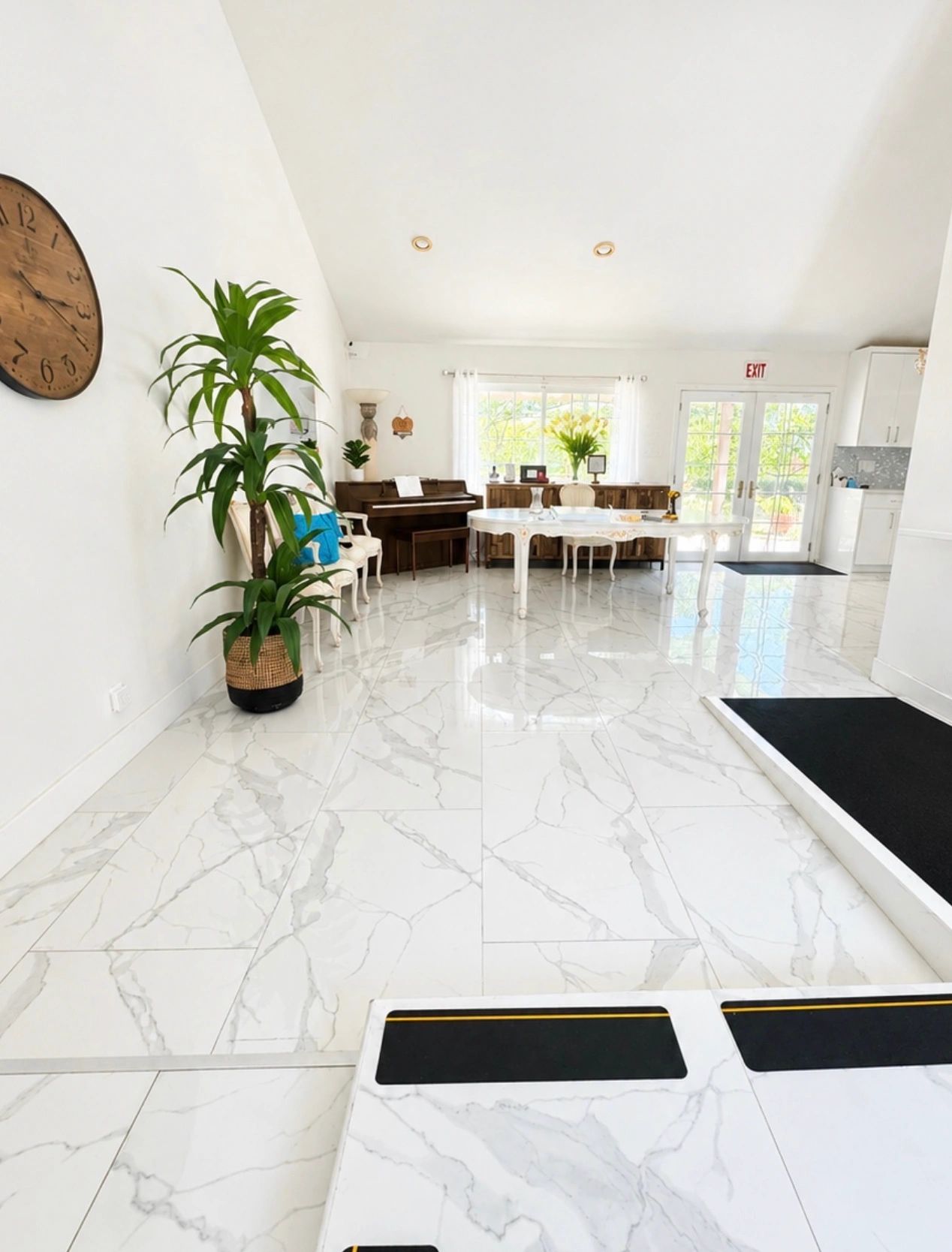 Bright, elegant room with marble floors and classic furniture.