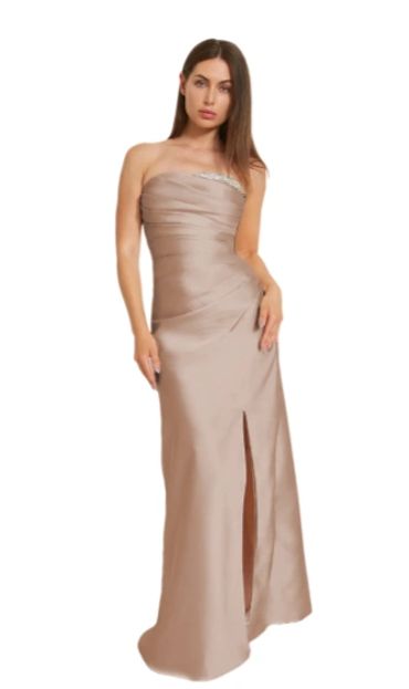 Elegant strapless beige evening gown with a front slit.