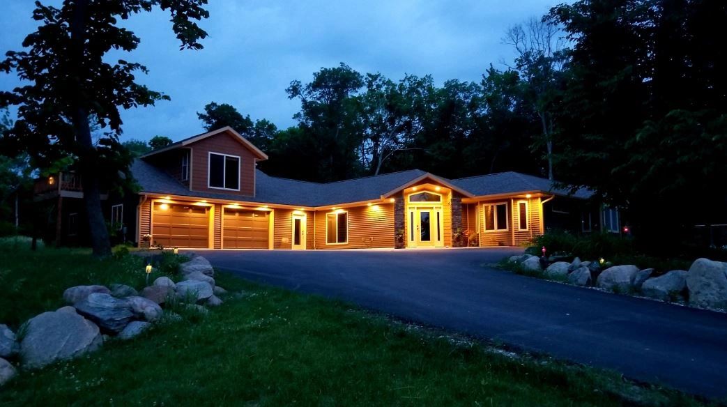 Custom rambler showcase built in Detroit Lakes, MN, featuring premium twilight accent lighting.