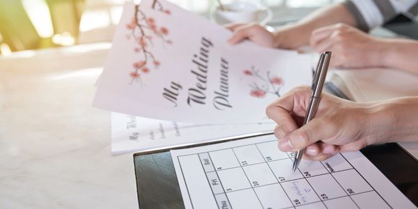 event planning papers on hands