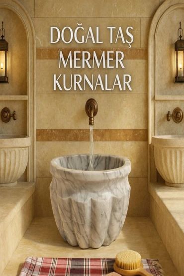 Elegant natural stone marble basin with water flowing from a brass faucet.