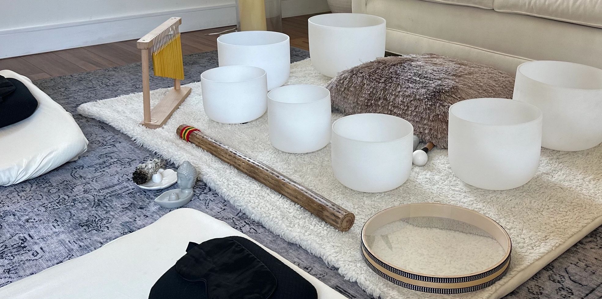 crystal quartz sound bowls and other healing instruments including an ocean drum and chimes 