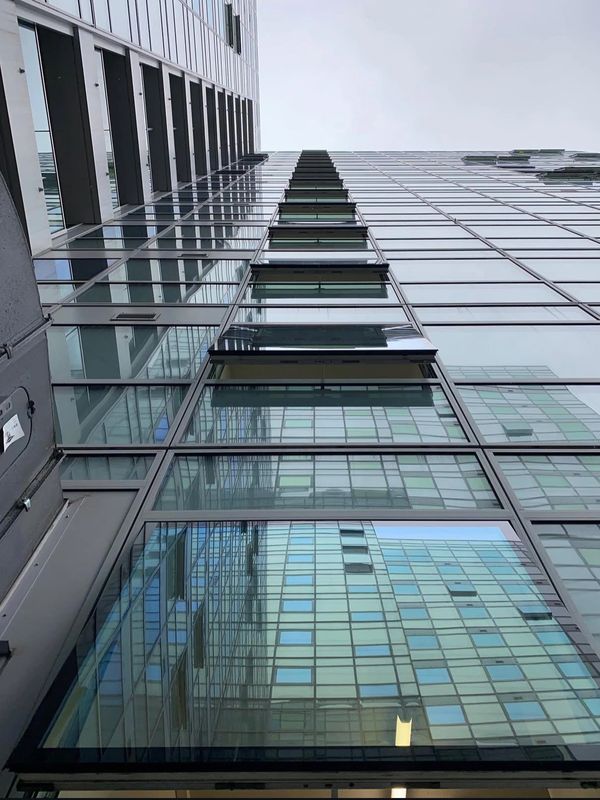 Glass windows on a modern building facade.