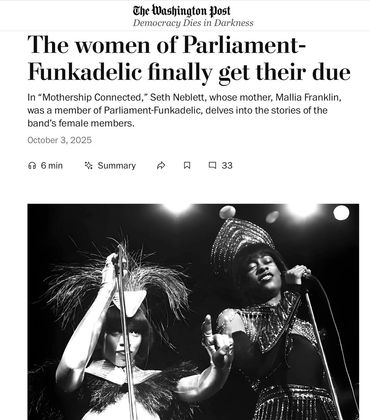 Two dynamic female performers from Parliament-Funkadelic passionately sing on stage in elaborate costumes.