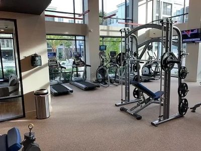 Smith machine installation featuring a cardio equipment installation. 
