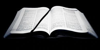 Open Bible with bookmark to the left side